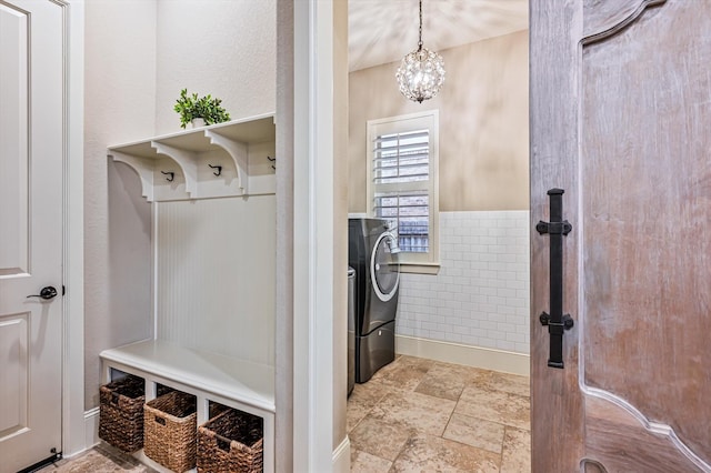 2919 Rutherford Place Ct, Katy, TX 77494 - mudroom with washer / clothes dryer, a chandelier, baseboards, and stone finish floors