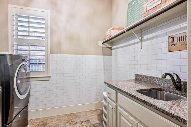 2919 Rutherford Place Ct, Katy, TX 77494 - laundry area with tile walls, a sink, and baseboards