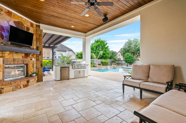 2919 Rutherford Place Ct, Katy, TX 77494 - fenced backyard with a patio, an outdoor living space with a fireplace, and ceiling fan