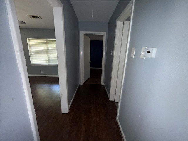 1307 Olive St, Baytown, TX 77520 - hallway featuring baseboards, wood finished floors, and attic access