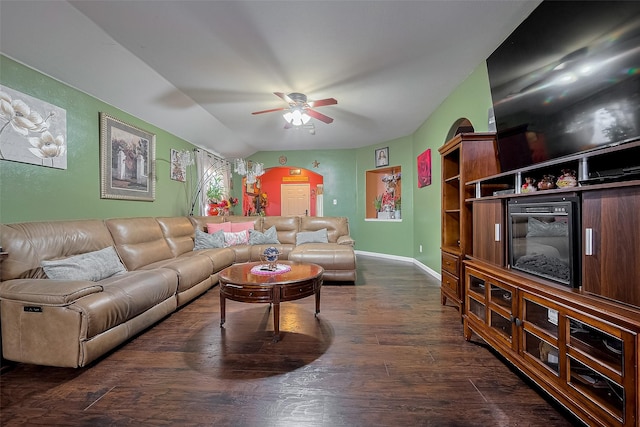 2902 Back Bay Brook Trl, Houston, TX 77045 - living area featuring ceiling fan, dark wood-style floors, arched walkways, and baseboards