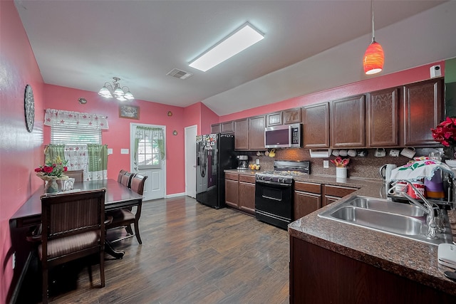 2902 Back Bay Brook Trl, Houston, TX 77045 - kitchen featuring black appliances, lofted ceiling, a chandelier, a sink, and decorative light fixtures