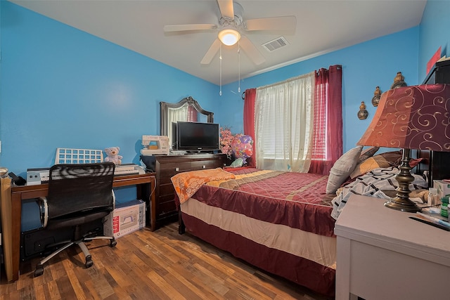 2902 Back Bay Brook Trl, Houston, TX 77045 - bedroom with wood finished floors, ceiling fan, and an office area