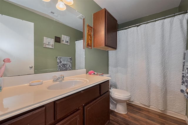 2902 Back Bay Brook Trl, Houston, TX 77045 - full bath with wood finished floors, toilet, vanity, and a shower with curtain