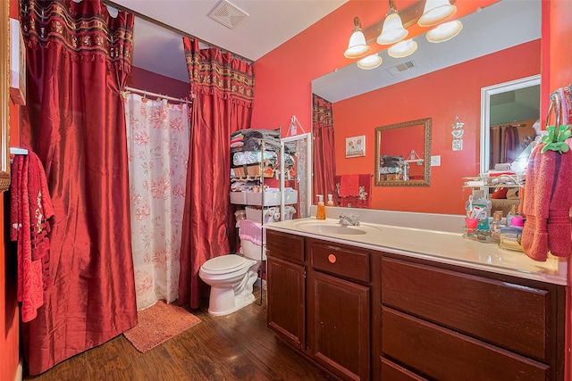 2902 Back Bay Brook Trl, Houston, TX 77045 - bathroom featuring wood finished floors, vanity, toilet, and a shower with curtain