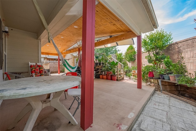 2902 Back Bay Brook Trl, Houston, TX 77045 - view of patio / terrace featuring fence, outdoor dining space, and stairway
