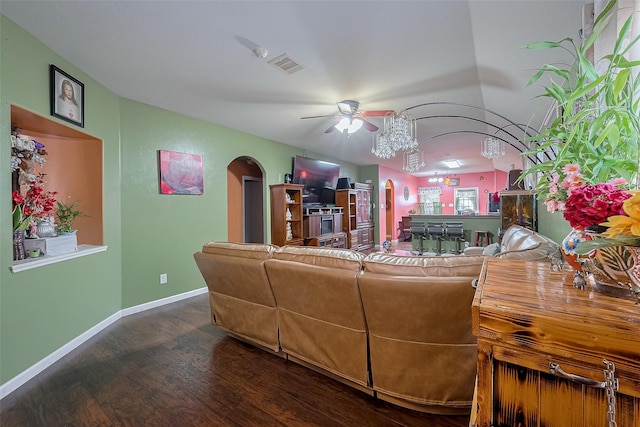 2902 Back Bay Brook Trl, Houston, TX 77045 - living area featuring arched walkways, dark wood-style floors, a ceiling fan, and baseboards