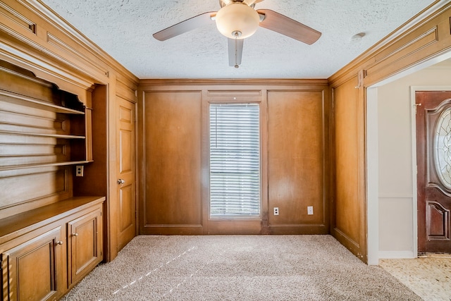 15714 Pebble Bend Dr, Houston, TX 77068 - empty room featuring a textured ceiling, ceiling fan, plenty of natural light, crown molding, and light colored carpet