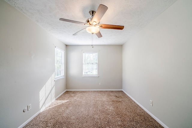 15714 Pebble Bend Dr, Houston, TX 77068 - unfurnished room with a textured ceiling, a ceiling fan, light colored carpet, and baseboards