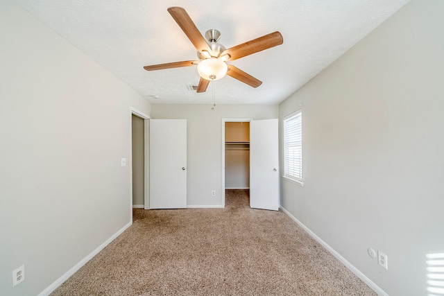 15714 Pebble Bend Dr, Houston, TX 77068 - unfurnished bedroom with carpet, baseboards, ceiling fan, a spacious closet, and a closet