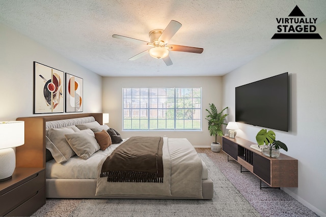 15714 Pebble Bend Dr, Houston, TX 77068 - carpeted bedroom with baseboards, a ceiling fan, and a textured ceiling