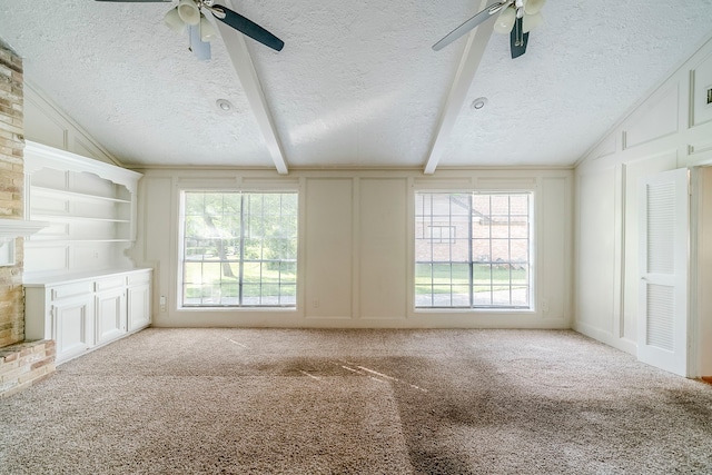 15714 Pebble Bend Dr, Houston, TX 77068 - unfurnished living room with ceiling fan, a textured ceiling, carpet floors, a decorative wall, and a fireplace