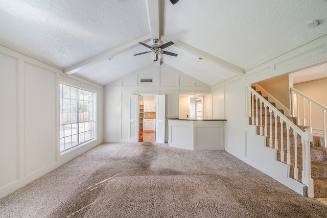 15714 Pebble Bend Dr, Houston, TX 77068 - unfurnished living room featuring a decorative wall, a ceiling fan, a textured ceiling, carpet, and stairway