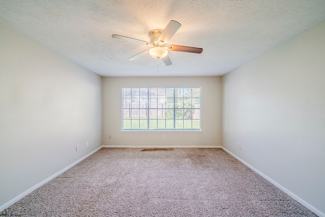 15714 Pebble Bend Dr, Houston, TX 77068 - carpeted empty room featuring a ceiling fan, a textured ceiling, and baseboards