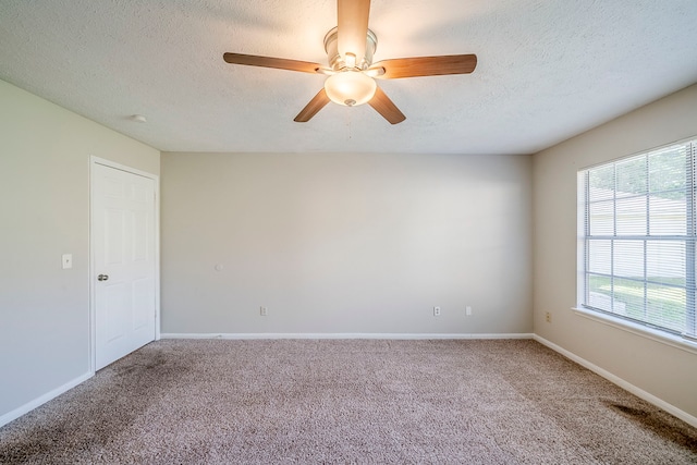 15714 Pebble Bend Dr, Houston, TX 77068 - carpeted spare room featuring a ceiling fan, a textured ceiling, and baseboards