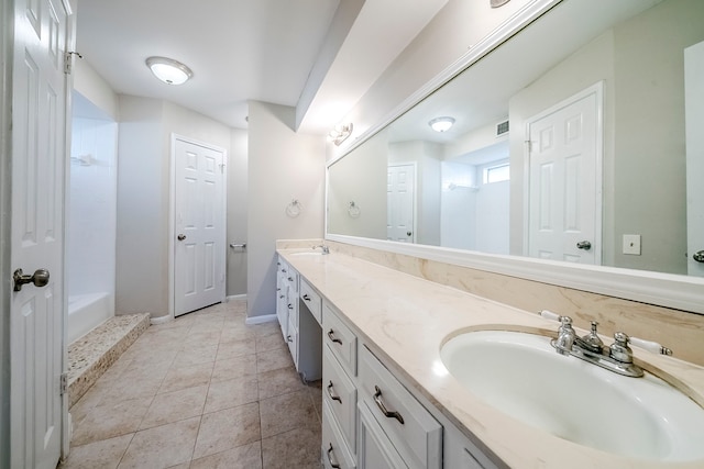 15714 Pebble Bend Dr, Houston, TX 77068 - full bath with double vanity, tile patterned flooring, and baseboards