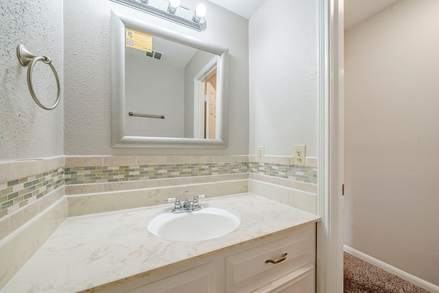 15714 Pebble Bend Dr, Houston, TX 77068 - bathroom with vanity and decorative backsplash