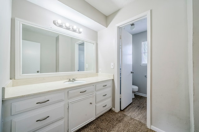 15714 Pebble Bend Dr, Houston, TX 77068 - bathroom featuring toilet, vanity, and baseboards