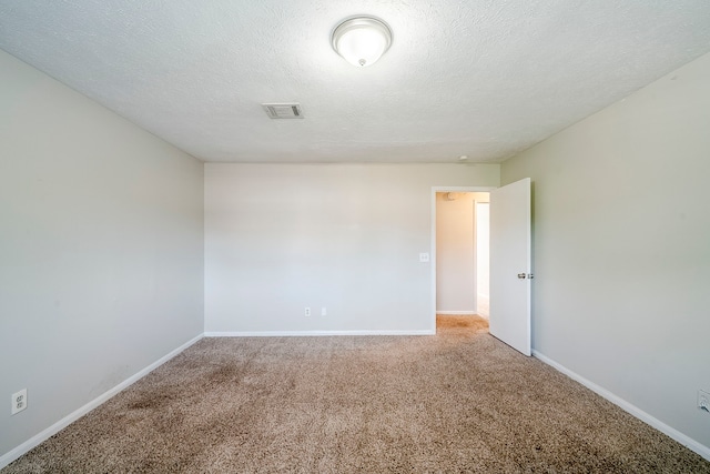15714 Pebble Bend Dr, Houston, TX 77068 - unfurnished room featuring carpet floors, baseboards, and a textured ceiling