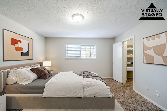 15714 Pebble Bend Dr, Houston, TX 77068 - bedroom featuring carpet flooring, baseboards, and a textured ceiling