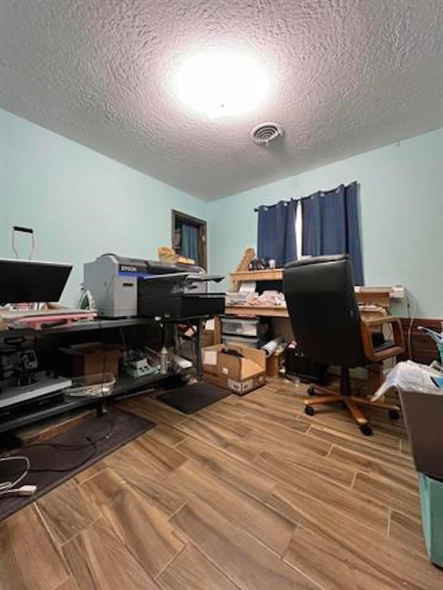 1005 Lamar St, Vidor, TX 77662 - office space featuring a textured ceiling and wood finish floors