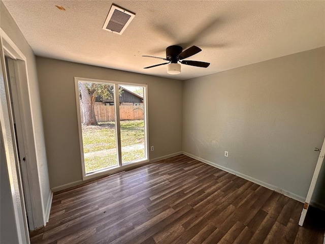 738 Beachcomber Ln, Houston, TX 77062 - unfurnished room featuring dark wood-type flooring, a ceiling fan, a textured ceiling, and baseboards