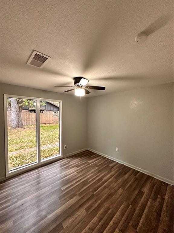 738 Beachcomber Ln, Houston, TX 77062 - unfurnished room with a ceiling fan, a textured ceiling, dark wood finished floors, and baseboards