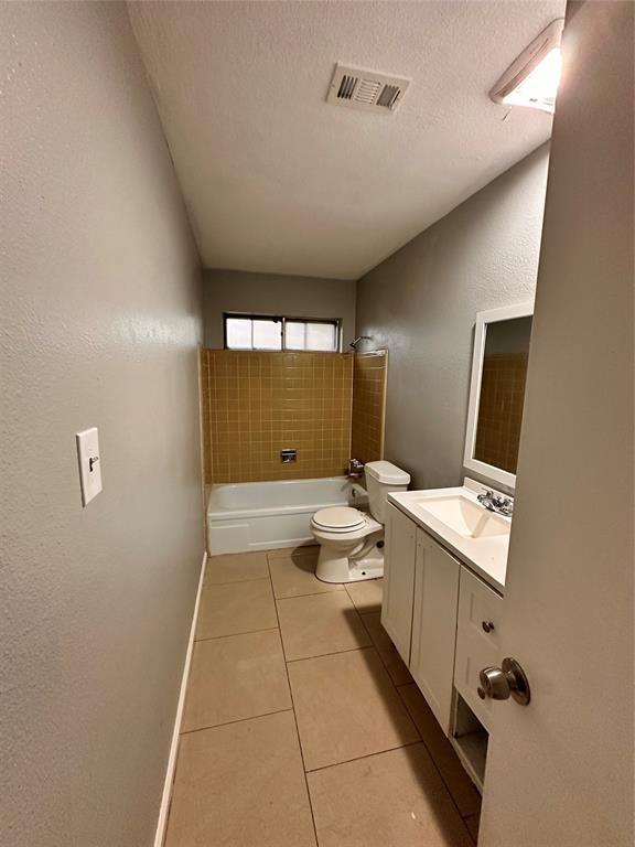 738 Beachcomber Ln, Houston, TX 77062 - bathroom with tile patterned floors, baseboards, toilet, vanity, and shower / bath combination