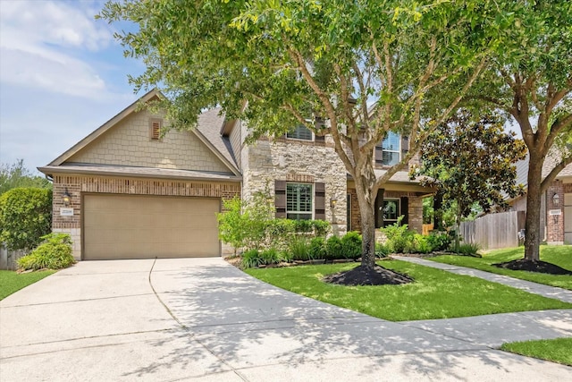 27208 Adrian Hills Ln, Spring, TX 77386 - view of front of home featuring stone siding, an attached garage, and driveway