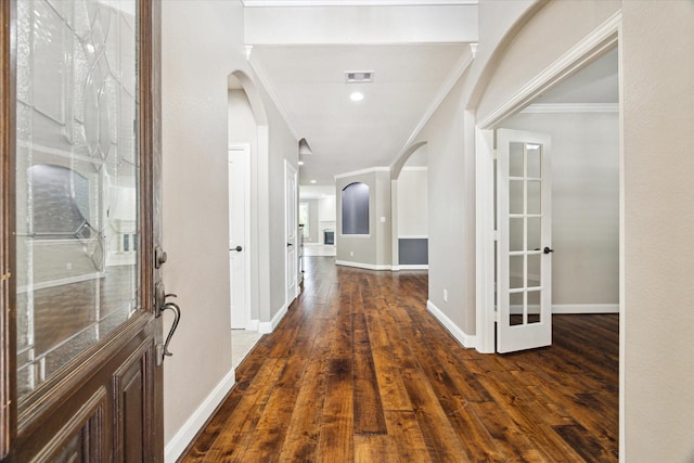 27208 Adrian Hills Ln, Spring, TX 77386 - entryway featuring arched walkways, ornamental molding, wood finished floors, and baseboards