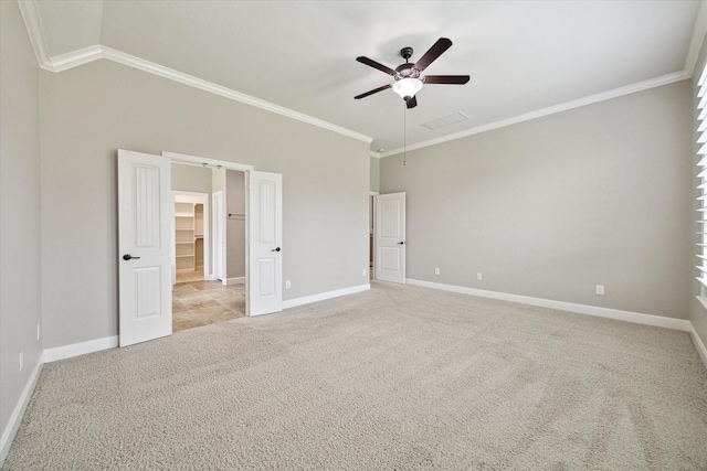 27208 Adrian Hills Ln, Spring, TX 77386 - unfurnished bedroom featuring carpet floors, crown molding, baseboards, a spacious closet, and ceiling fan