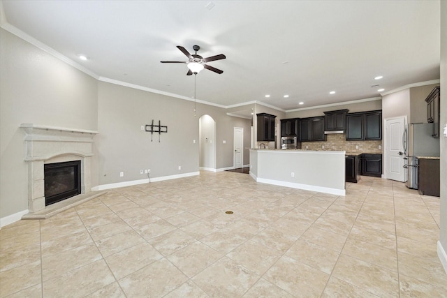 27208 Adrian Hills Ln, Spring, TX 77386 - unfurnished living room with a ceiling fan, recessed lighting, arched walkways, crown molding, and light tile patterned floors