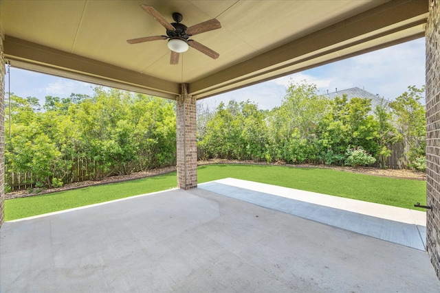 27208 Adrian Hills Ln, Spring, TX 77386 - view of patio / terrace with a ceiling fan and view of wooded area