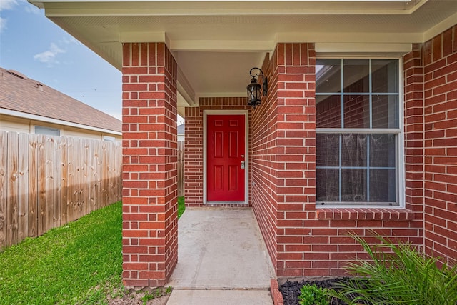 2706 Star Peak Dr, Houston, TX 77088 - view of exterior entry featuring brick siding and fence