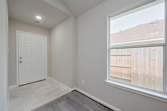 2706 Star Peak Dr, Houston, TX 77088 - foyer entrance with baseboards and wood finished floors