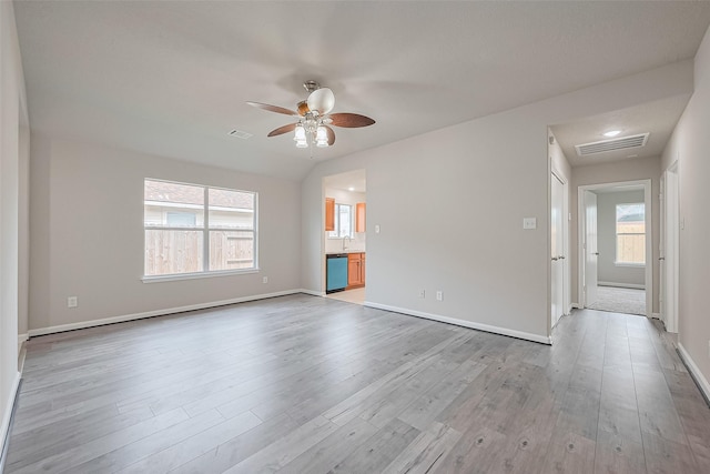 2706 Star Peak Dr, Houston, TX 77088 - unfurnished room featuring a ceiling fan, wood finished floors, baseboards, and a sink