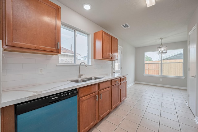 2706 Star Peak Dr, Houston, TX 77088 - kitchen featuring dishwasher, a sink, decorative backsplash, light tile patterned floors, and baseboards