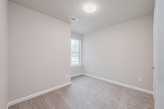2706 Star Peak Dr, Houston, TX 77088 - unfurnished room featuring carpet flooring, a textured ceiling, and baseboards
