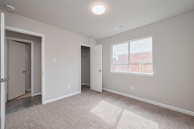 2706 Star Peak Dr, Houston, TX 77088 - unfurnished bedroom featuring carpet floors, baseboards, and a closet