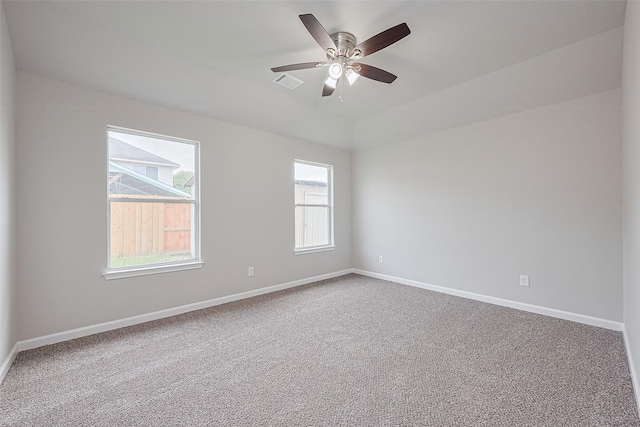 2706 Star Peak Dr, Houston, TX 77088 - empty room featuring plenty of natural light, carpet flooring, baseboards, and vaulted ceiling