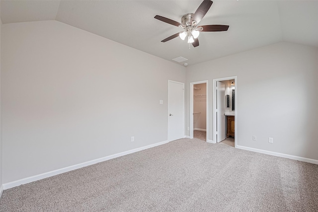 2706 Star Peak Dr, Houston, TX 77088 - unfurnished bedroom with vaulted ceiling, a walk in closet, light colored carpet, baseboards, and a closet