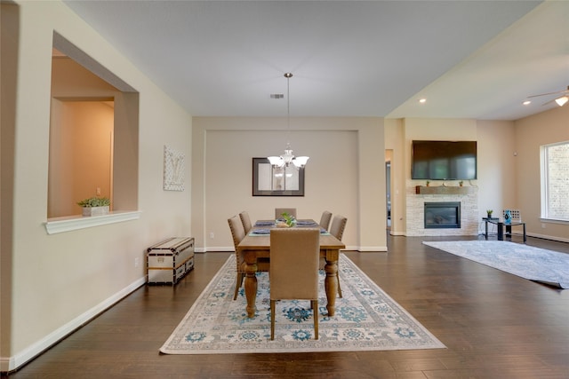 4218 Tanner Woods Ln, Sugar Land, TX 77479 - dining area with wood finished floors, baseboards, recessed lighting, a chandelier, and a stone fireplace