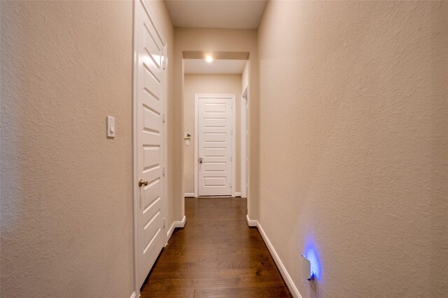 4218 Tanner Woods Ln, Sugar Land, TX 77479 - hall with dark wood-style floors, baseboards, and a textured wall