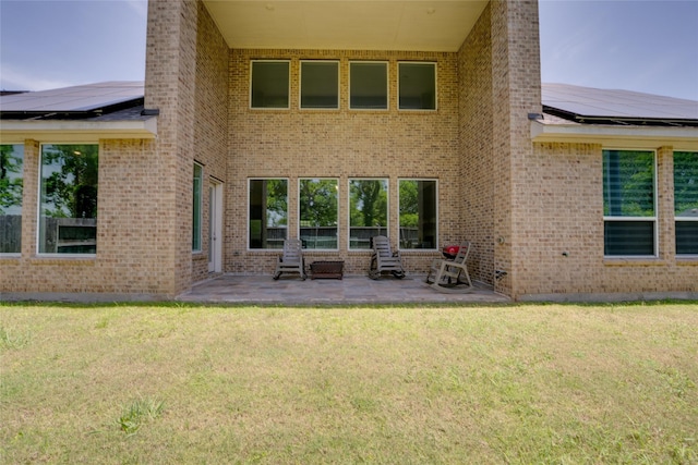 4218 Tanner Woods Ln, Sugar Land, TX 77479 - back of property featuring a patio, solar panels, and a yard