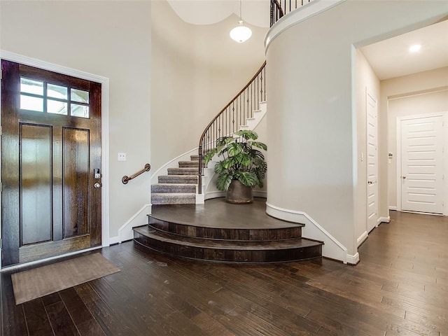 4218 Tanner Woods Ln, Sugar Land, TX 77479 - foyer entrance featuring wood-type flooring, stairs, baseboards, and a towering ceiling