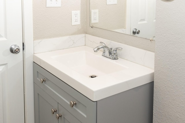 108 Chandler Dr, Baytown, TX 77521 - bathroom with vanity and a textured wall
