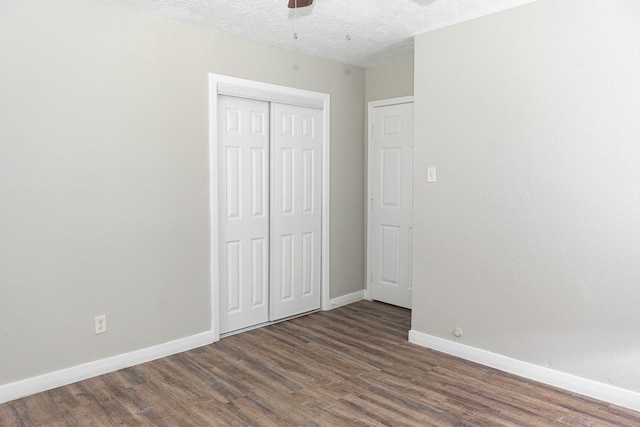 108 Chandler Dr, Baytown, TX 77521 - unfurnished bedroom with baseboards, wood finished floors, a closet, a textured ceiling, and a ceiling fan