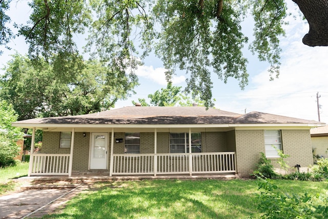 108 Chandler Dr, Baytown, TX 77521 - single story home with brick siding, covered porch, and a front yard