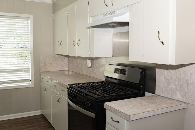 108 Chandler Dr, Baytown, TX 77521 - kitchen with stainless steel range with gas stovetop, under cabinet range hood, tasteful backsplash, light countertops, and baseboards