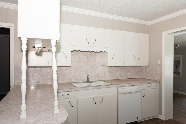 108 Chandler Dr, Baytown, TX 77521 - kitchen featuring white dishwasher, a sink, light countertops, tasteful backsplash, and white cabinetry